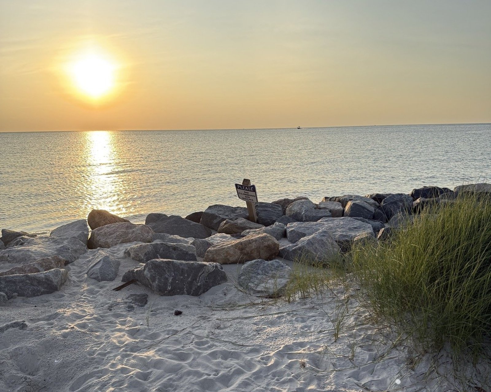 Cape Charles beach sunset with rocks and sand — Eastern Shore Virginia